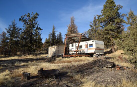 Wooded 34 acres vacant land with great access bordering public land in Klamath County, Oregon.